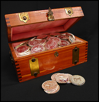 treasure chest and silver dollars by Renaude Hatsedakis